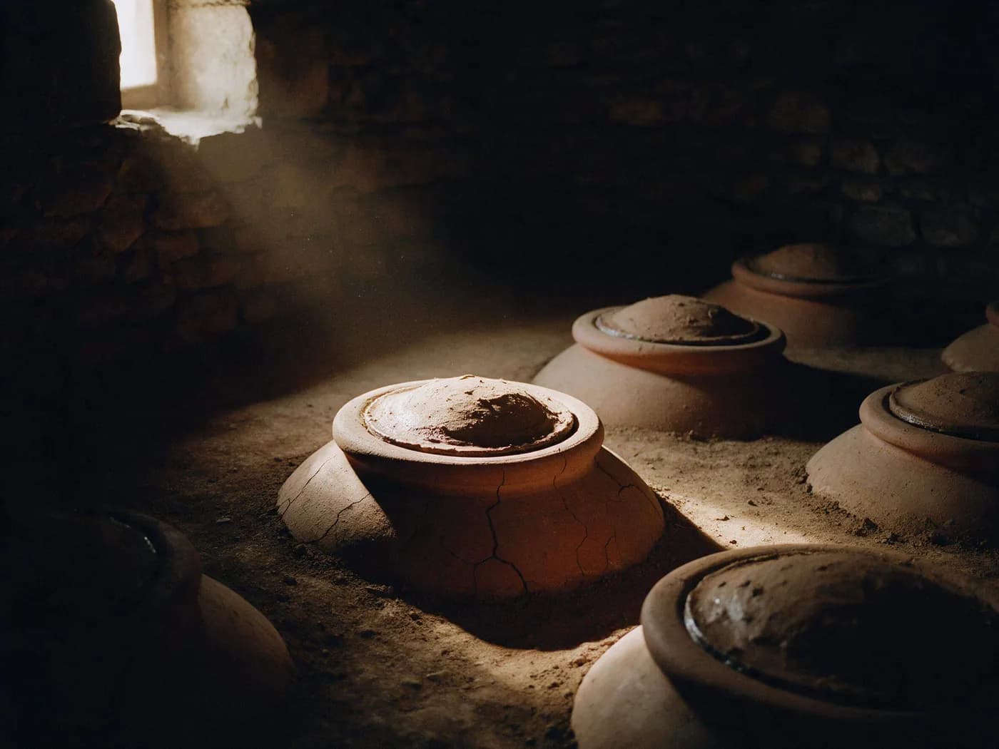 Illustration: qvevri set into the floor of a wine cellar